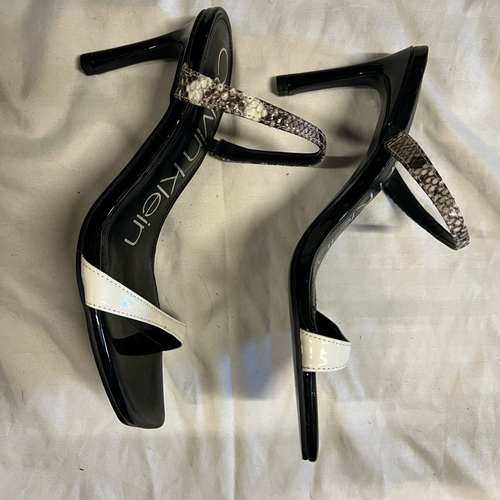 Calvin Klein never worn heeled mules leather dress up or down!